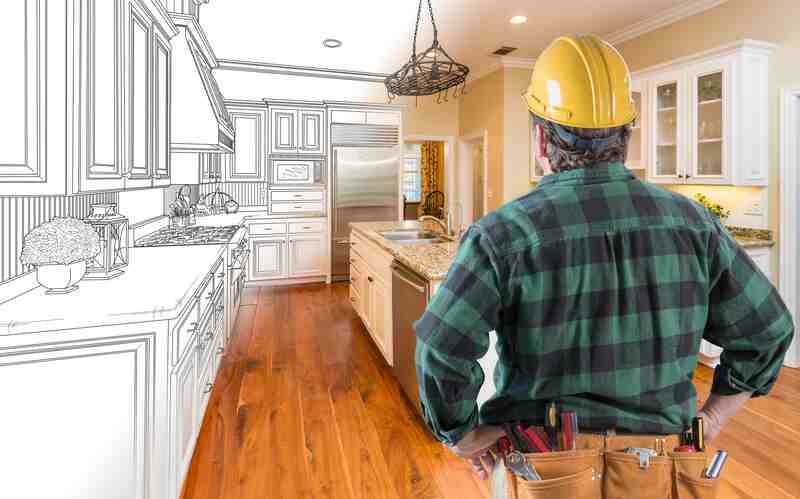 Male Contractor Looking At Custom Kitchen Drawing Photo Combination