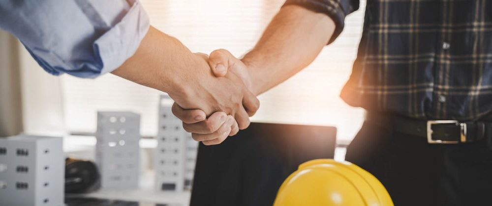 shaking hands after hiring contractor