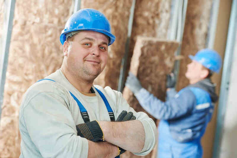 Construction worker at insulation work